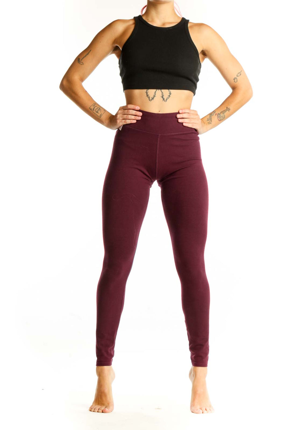 Front view of burgundy high-waisted Pact leggings on model