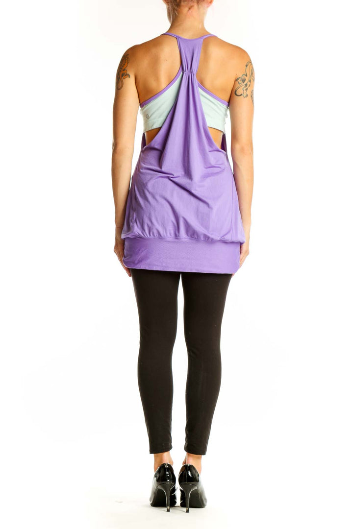 Side view of purple Lululemon flowy workout tank top with fitted waistband