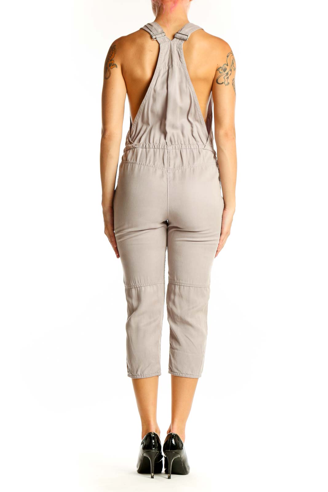 Side view of Wilfred Free beige Lyocell capri jumpsuit showing adjustable straps
