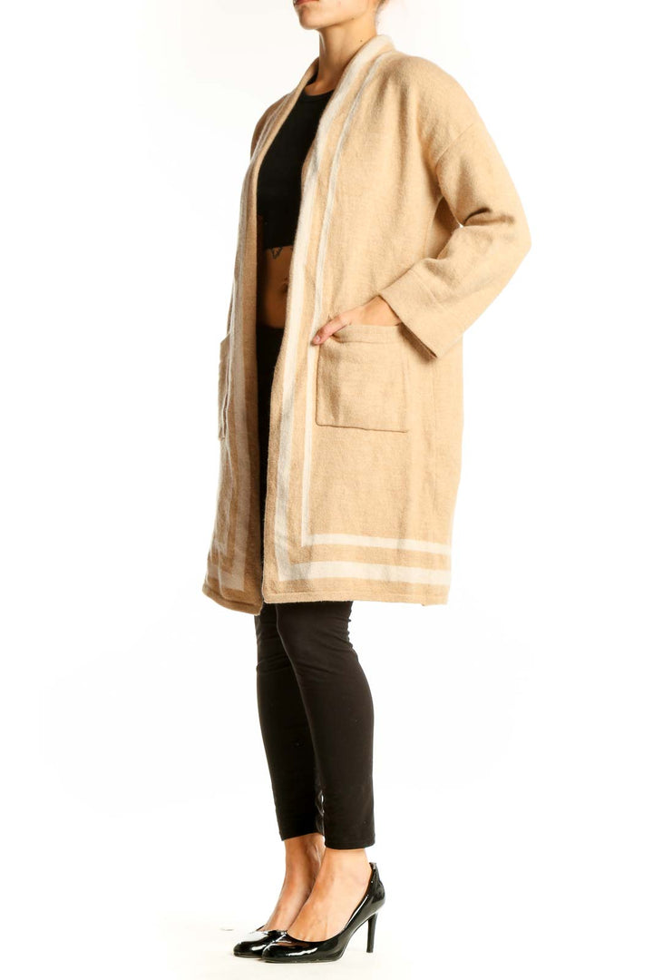 Front view of JMcLaughlin beige Merino wool long cardigan with shawl collar