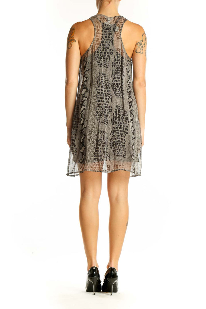 Side view of Joie gray snake print sleeveless mini dress on model