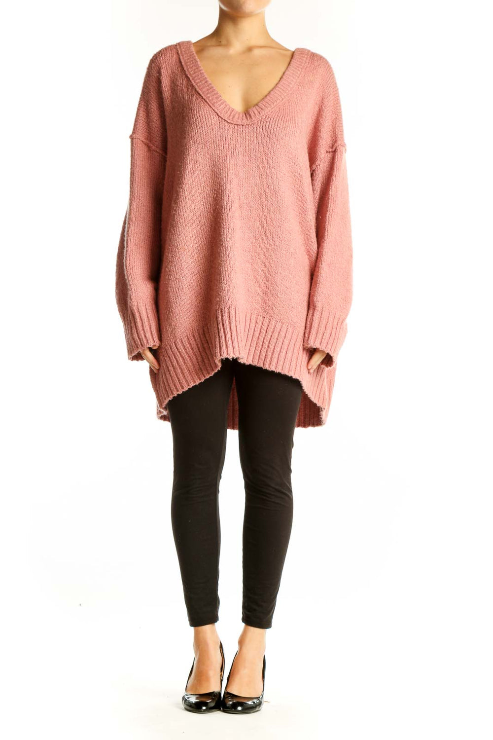 Front view of pink oversized V-neck knit sweater from Free People