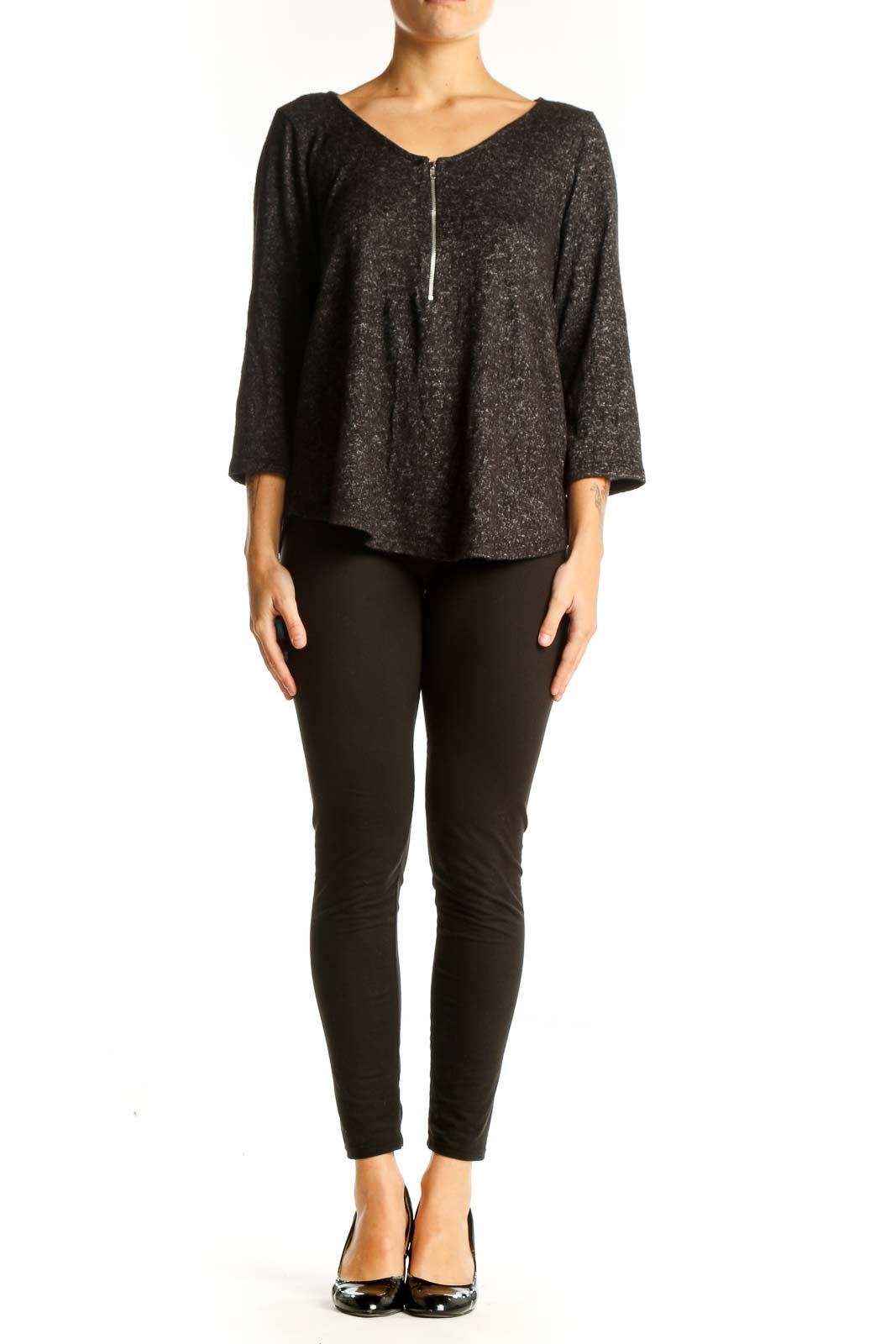 Front view of Green Envelope black sparkly blouse with zip-front design