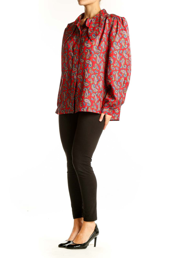 Front view of Laura & Jayne red paisley print button-up blouse