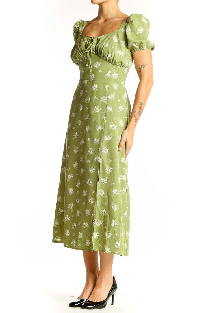 Front view of green floral midi dress with puff sleeves and square neckline