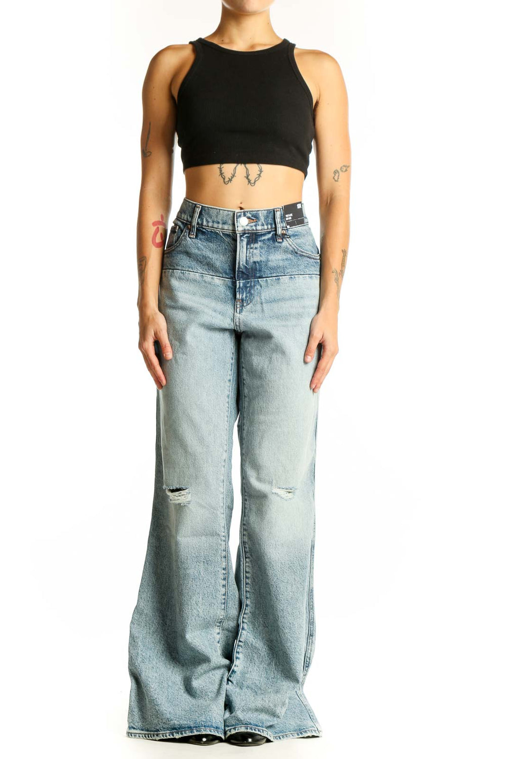 Front view of Gap light blue distressed wide-leg jeans on model