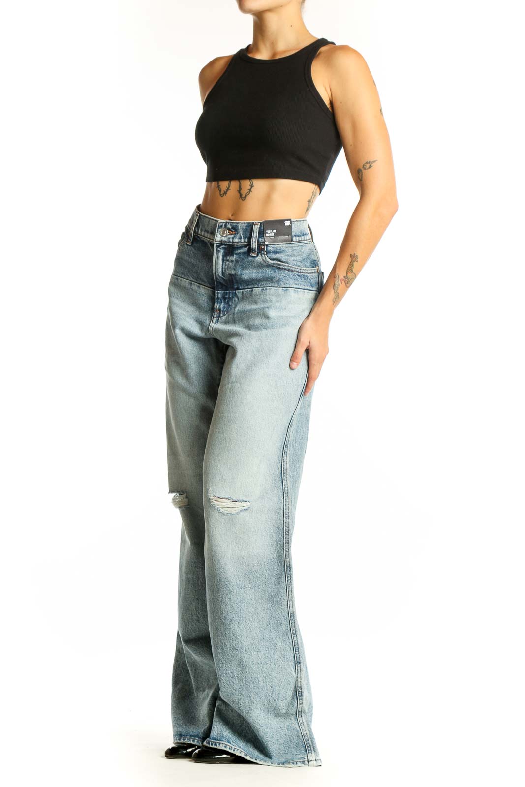 Front view of Gap light blue distressed wide-leg jeans on model
