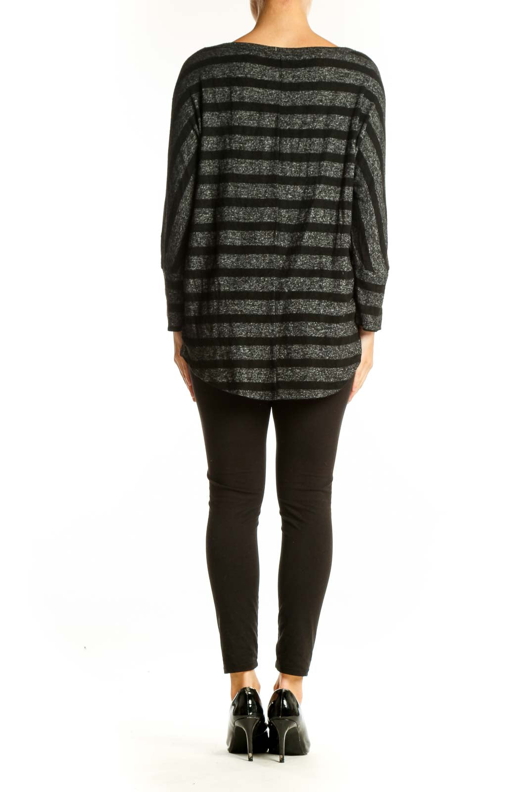 Side view of Mix by 41 Hawthorn Black Striped Long Sleeve Knit Top on model