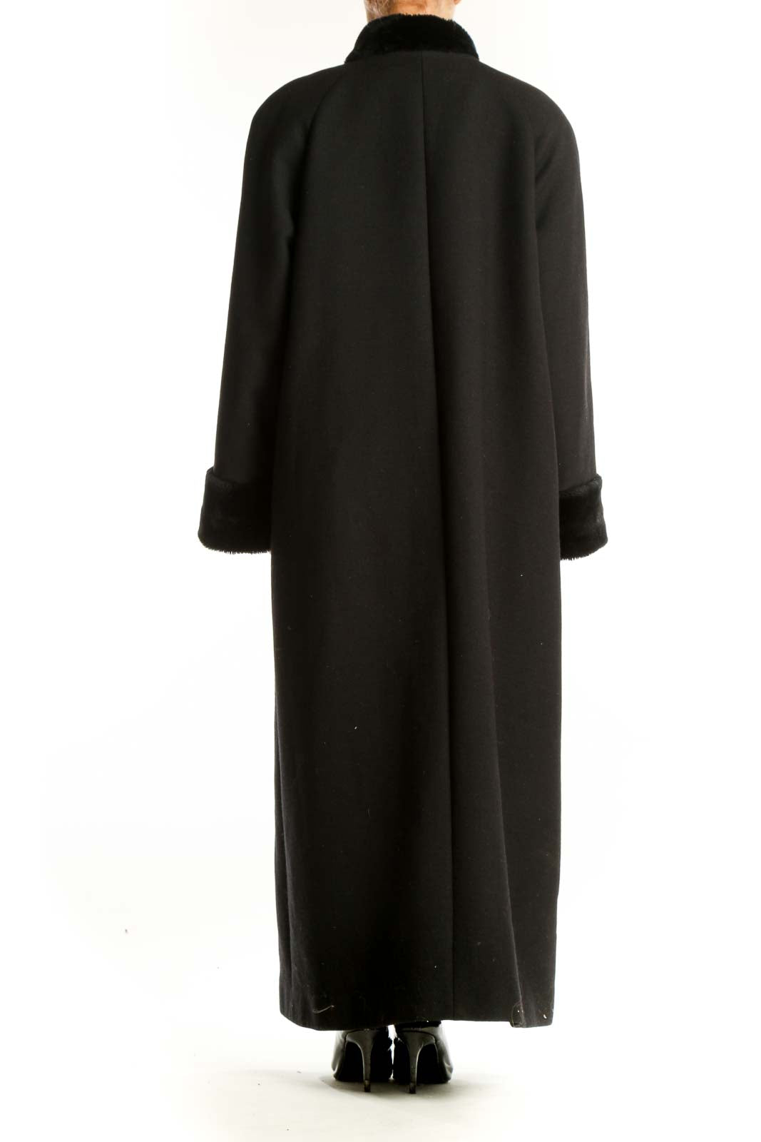 Side view of Harve Bernard black full-length coat showing length and fit