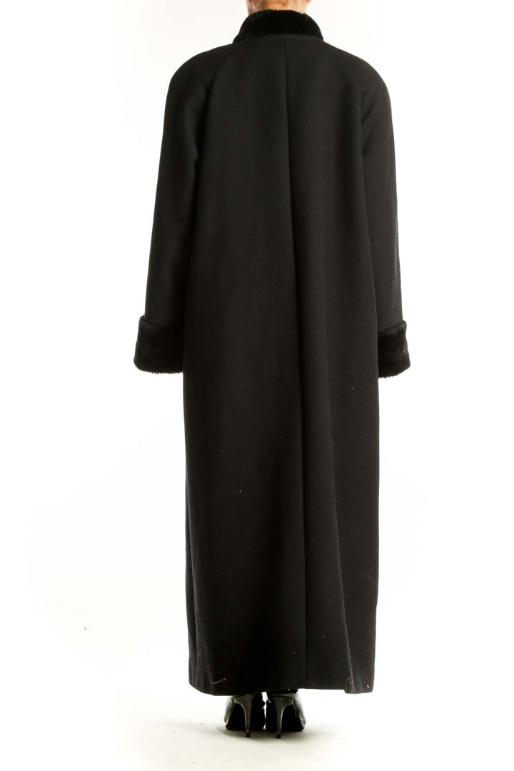 Side view of Harve Bernard black full-length coat showing length and fit