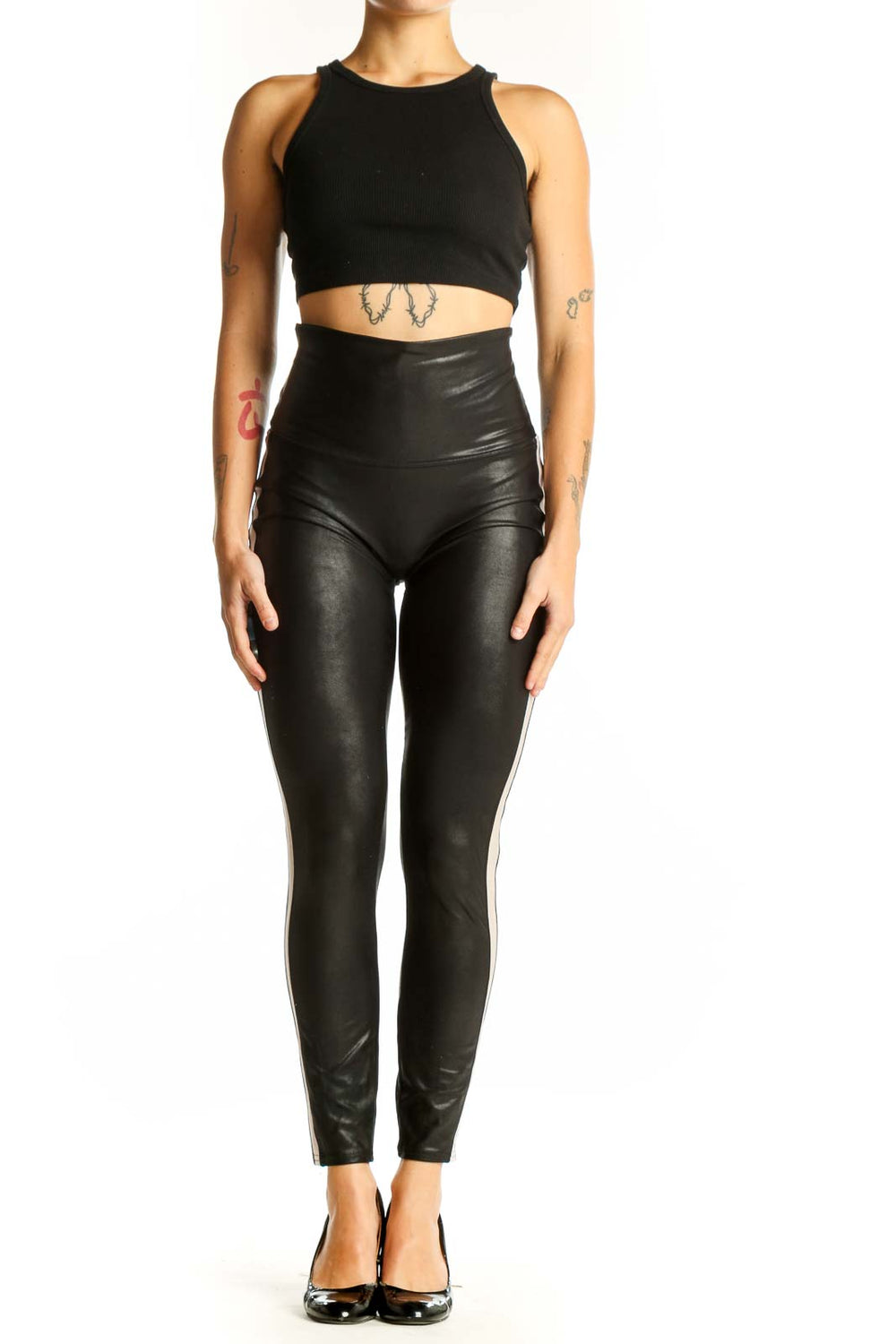 Front view of Spanx black high-waisted faux leather leggings with white side stripe