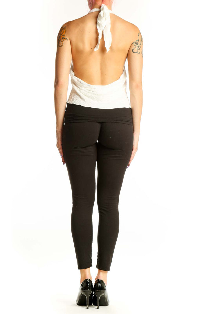 White halter twist crop top with open back design, back view