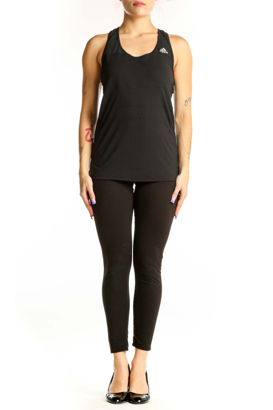 Black Adidas racerback athletic tank top with logo, front view on model