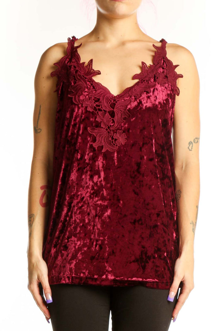 Burgundy velvet camisole top with ruffle neckline and adjustable straps, front view