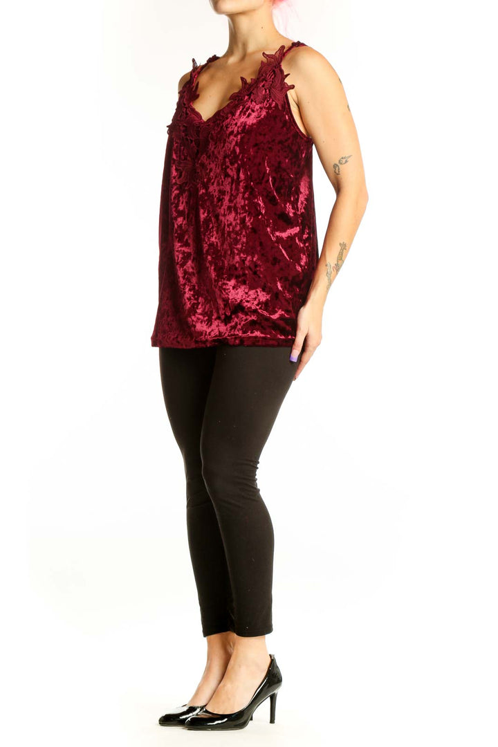 Burgundy velvet camisole top with ruffle neckline and adjustable straps, front view