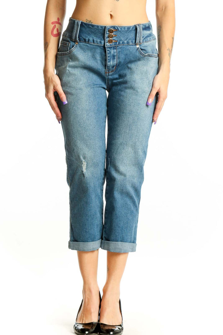 Blue denim cropped jeans with rolled cuffs and distressed thigh detailing, front view