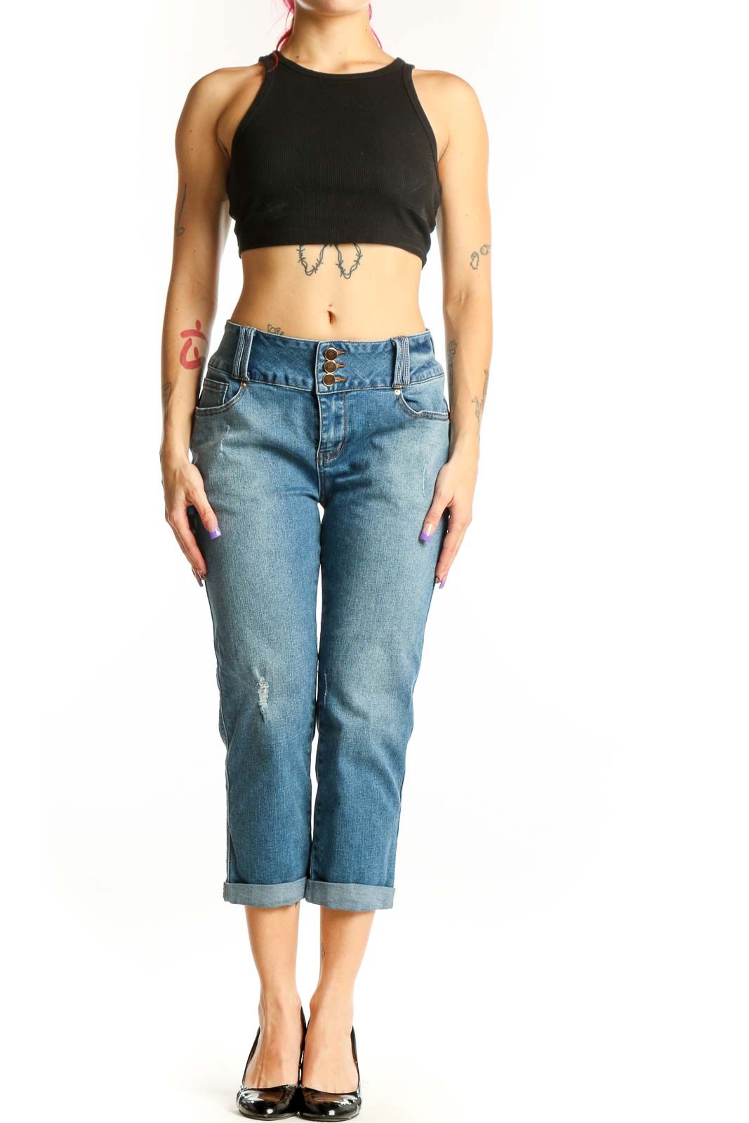 Blue denim cropped jeans with rolled cuffs and distressed thigh detailing, front view