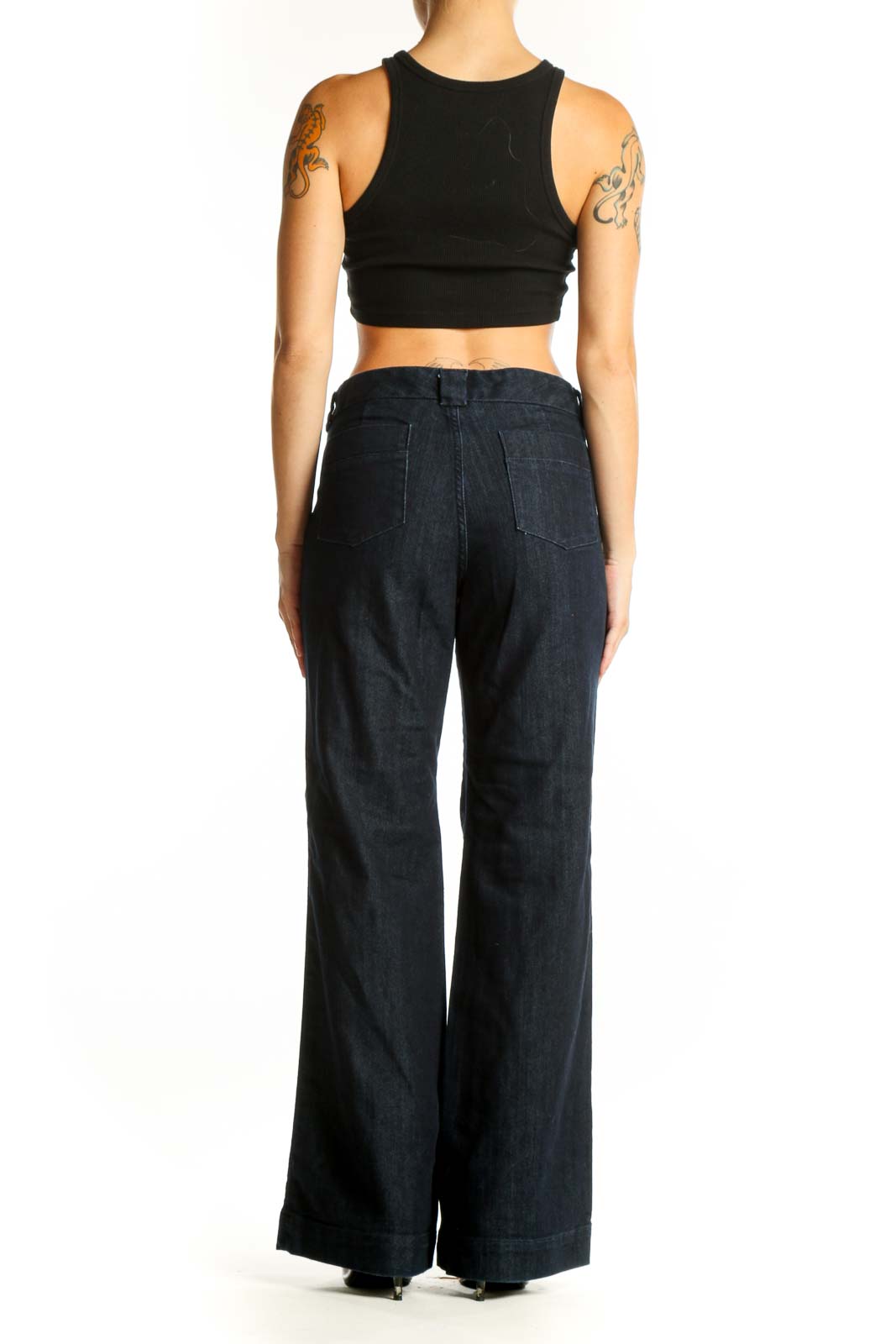 Side view of woman wearing Banana Republic dark blue wide-leg denim trousers