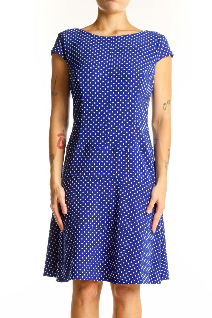 Front view of Anne Klein blue polka dot A-line dress with cap sleeves