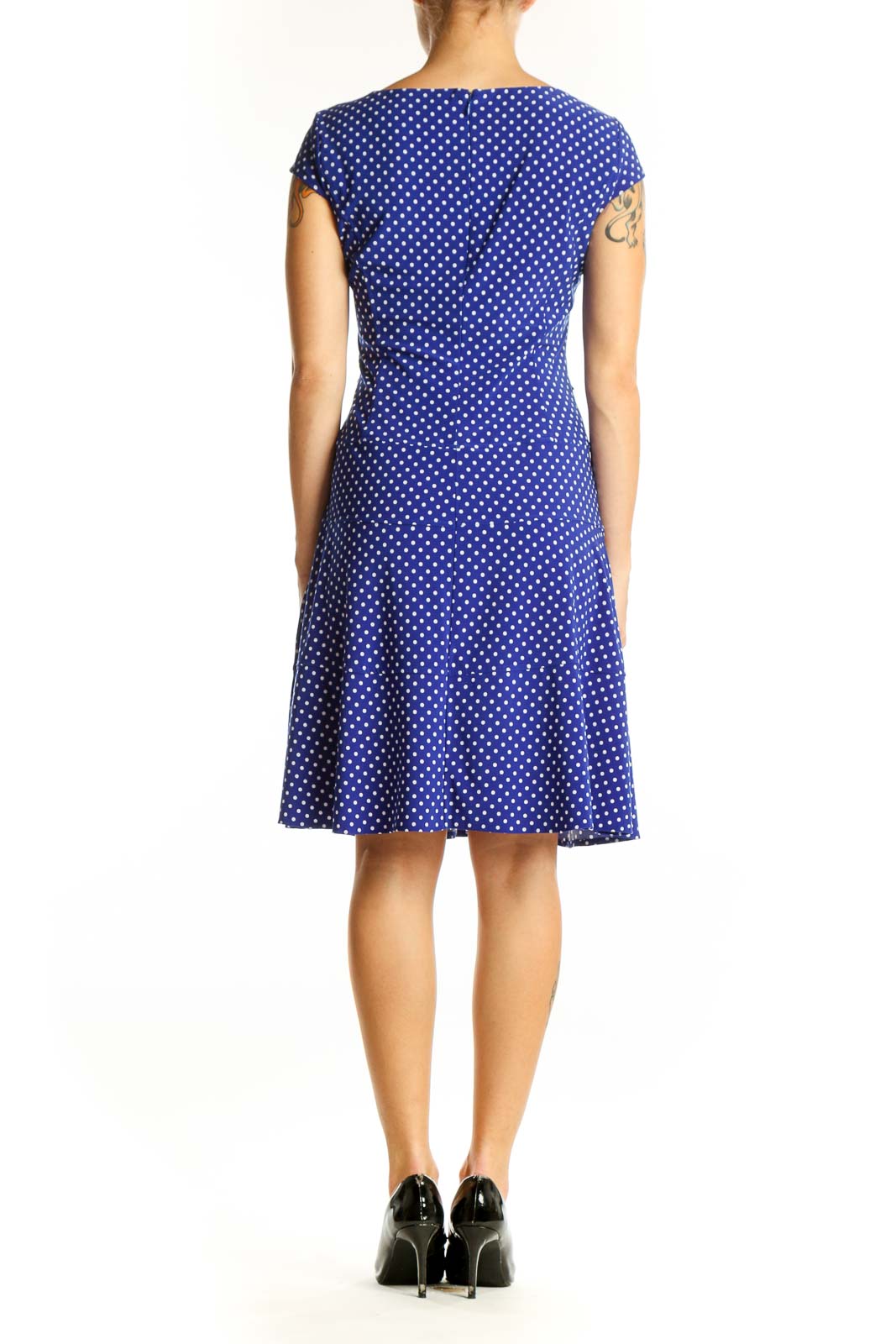 Back view of Anne Klein blue polka dot A-line dress showing flared skirt