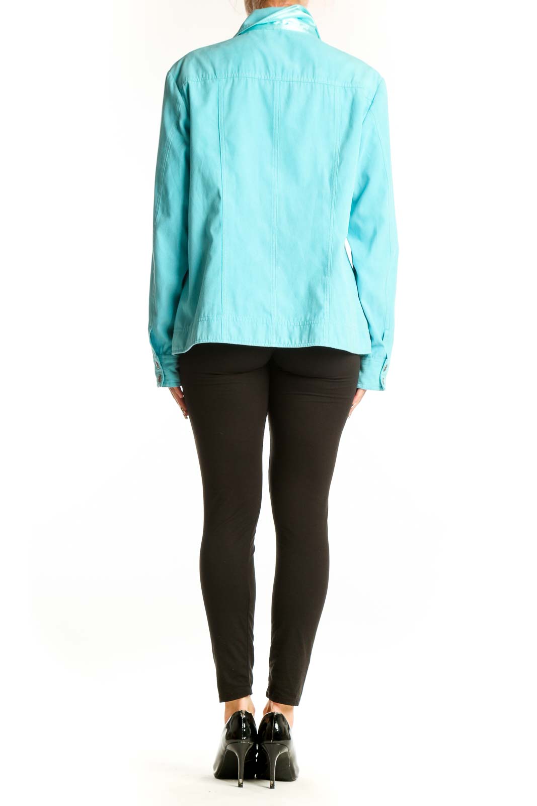 Side view of woman wearing Amber Sun aqua lightweight jacket with black pants