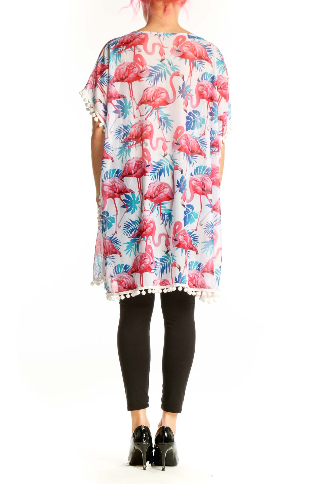 Cream tunic top with flamingo and palm leaf print, white pom-pom trim detail, back view