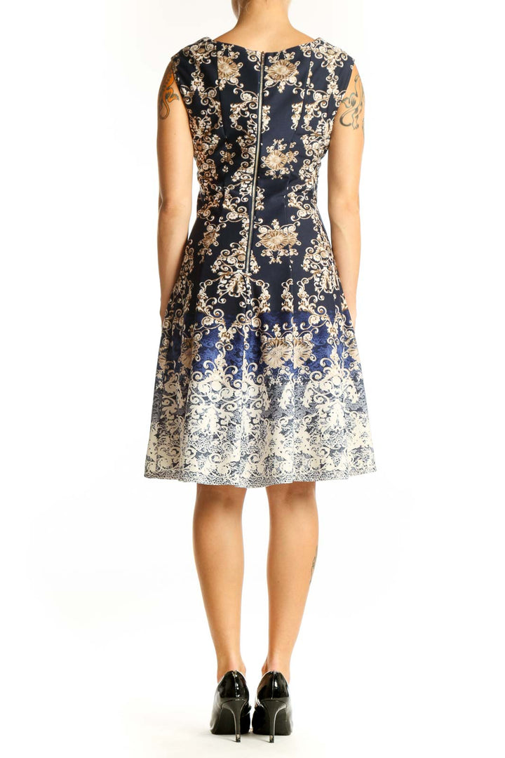 Back view of Gabby Skye Navy Floral Ombre Fit-and-Flare Dress showing full skirt