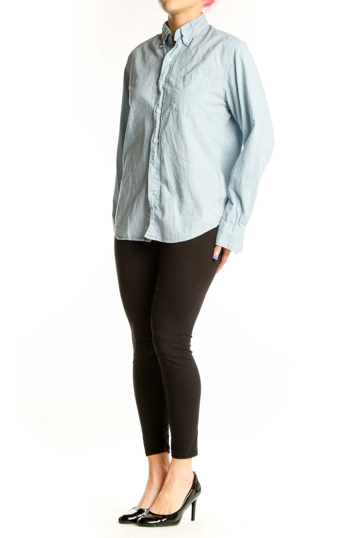 Front view of blue striped J.Crew button-down shirt with long sleeves and chest pocket