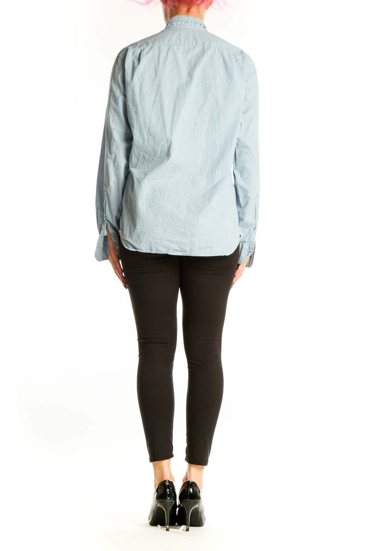 Back view of blue striped J.Crew button-down shirt showing relaxed fit and vertical stripe pattern