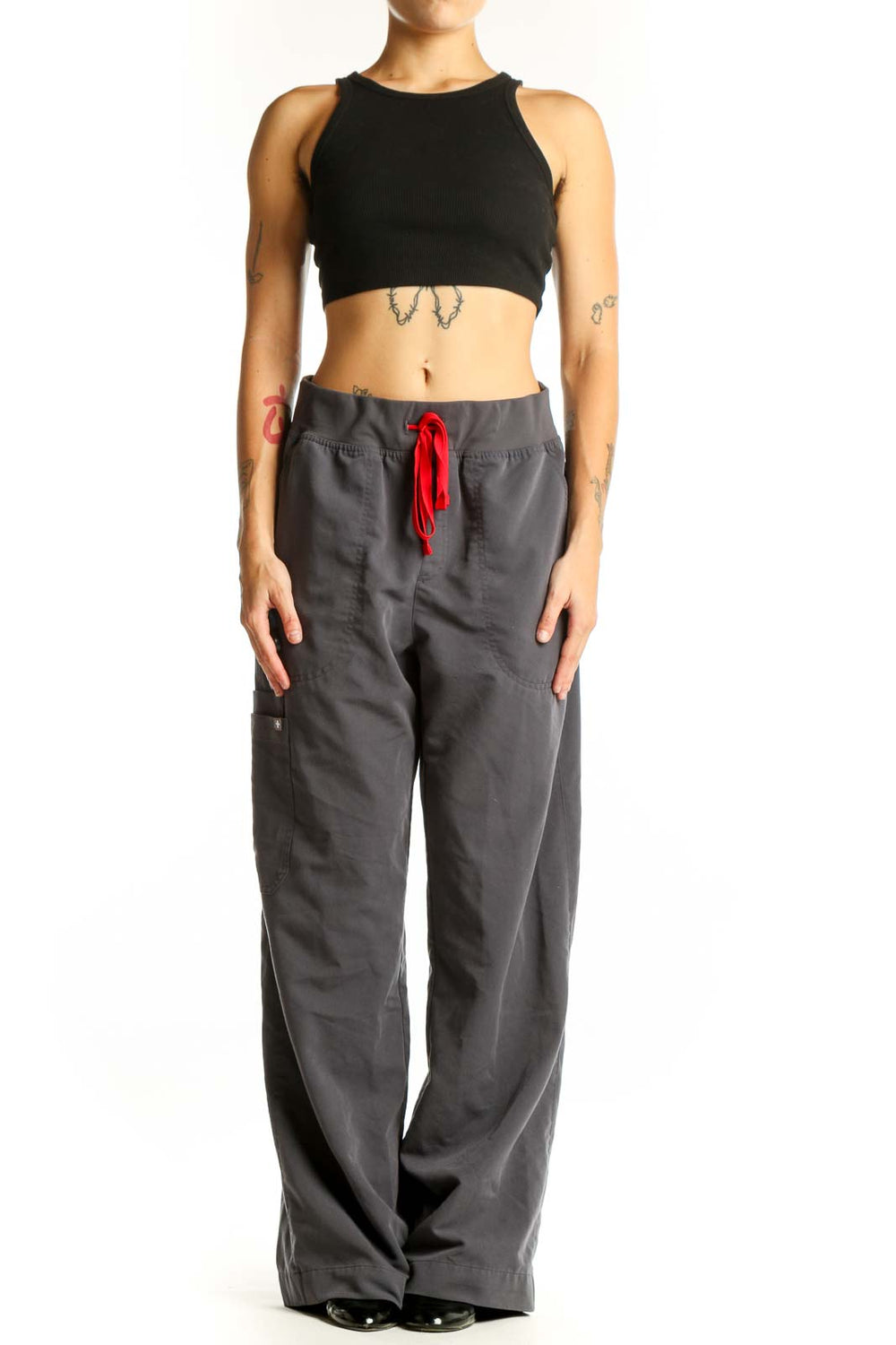Front view of FIGS gray cargo scrub pants with red drawstring
