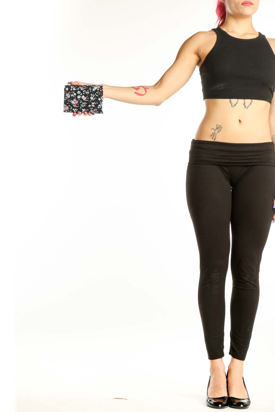 Black Floral Vera Bradley Clutch with pink and white flowers held in hand, showing quilted design and compact size