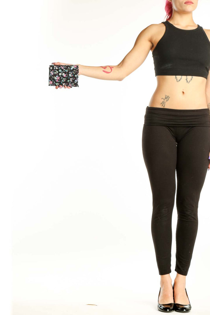 Black Floral Vera Bradley Clutch with pink and white flowers held in hand, showing quilted design and compact size