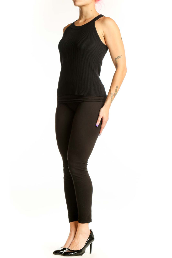 Black ribbed sleeveless tank top with crew neckline, front view on model