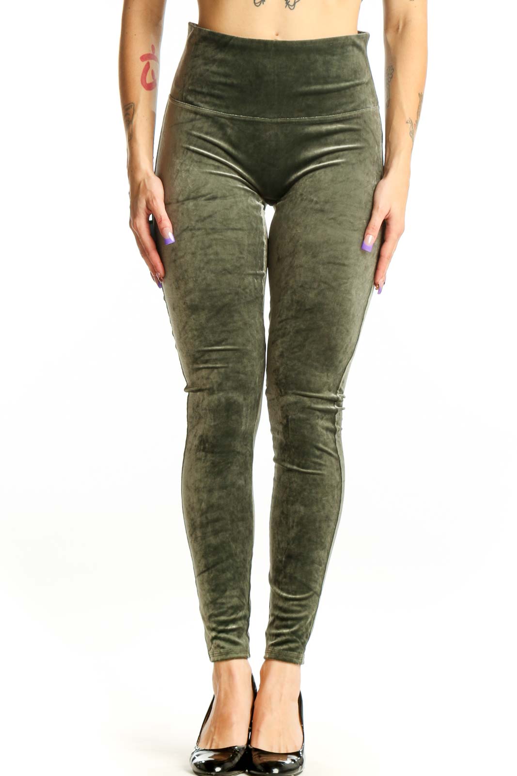 Front view of green velvet Spanx leggings with high-waisted design and full-length cut on model