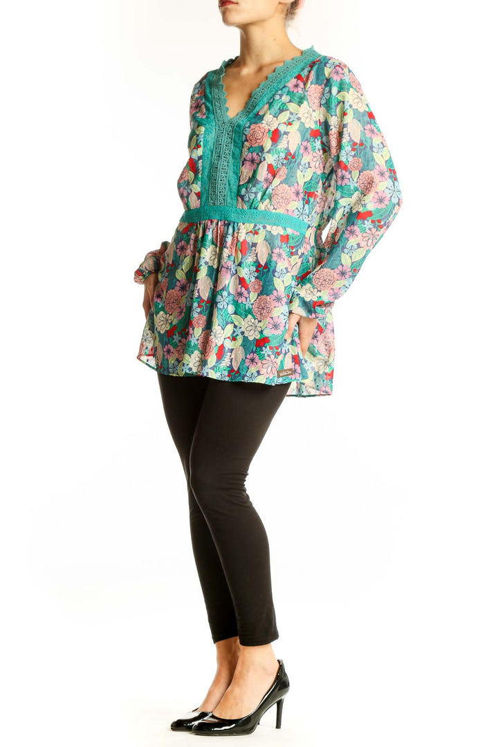 Front view of Matilda Jane teal floral tunic top with lace trim and V-neckline