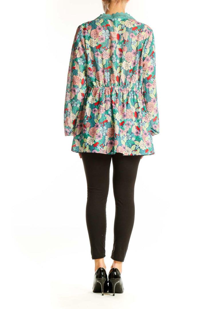 Side view of Matilda Jane teal floral tunic top showing flowy silhouette and long sleeves