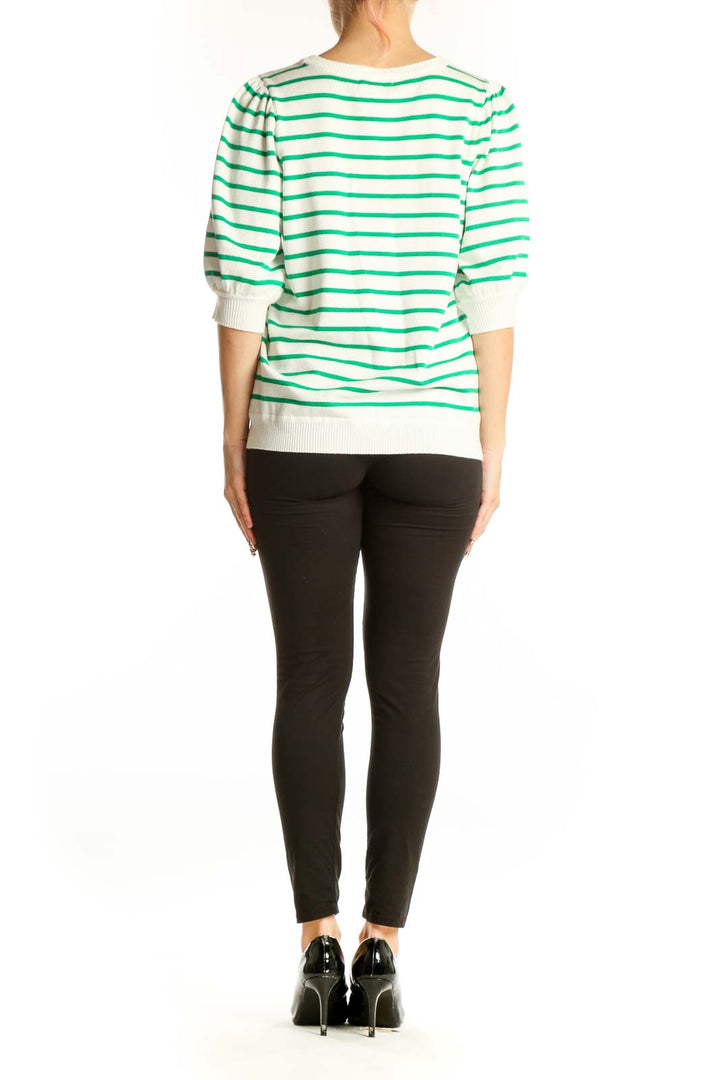 Side view of green and white striped short-sleeve knit top by Marled on model