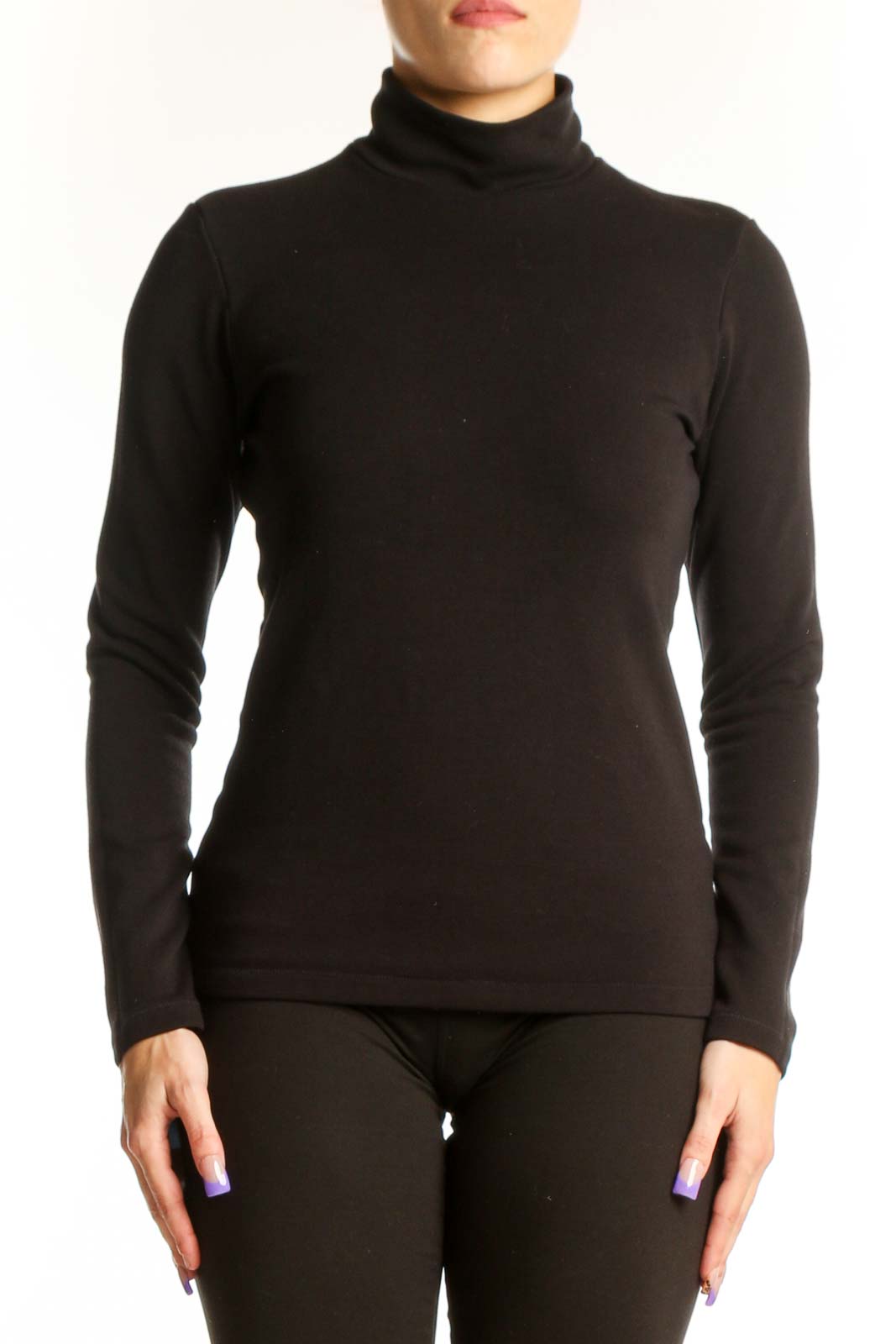 Black turtleneck long sleeve fitted top by Uniqlo, front view on model