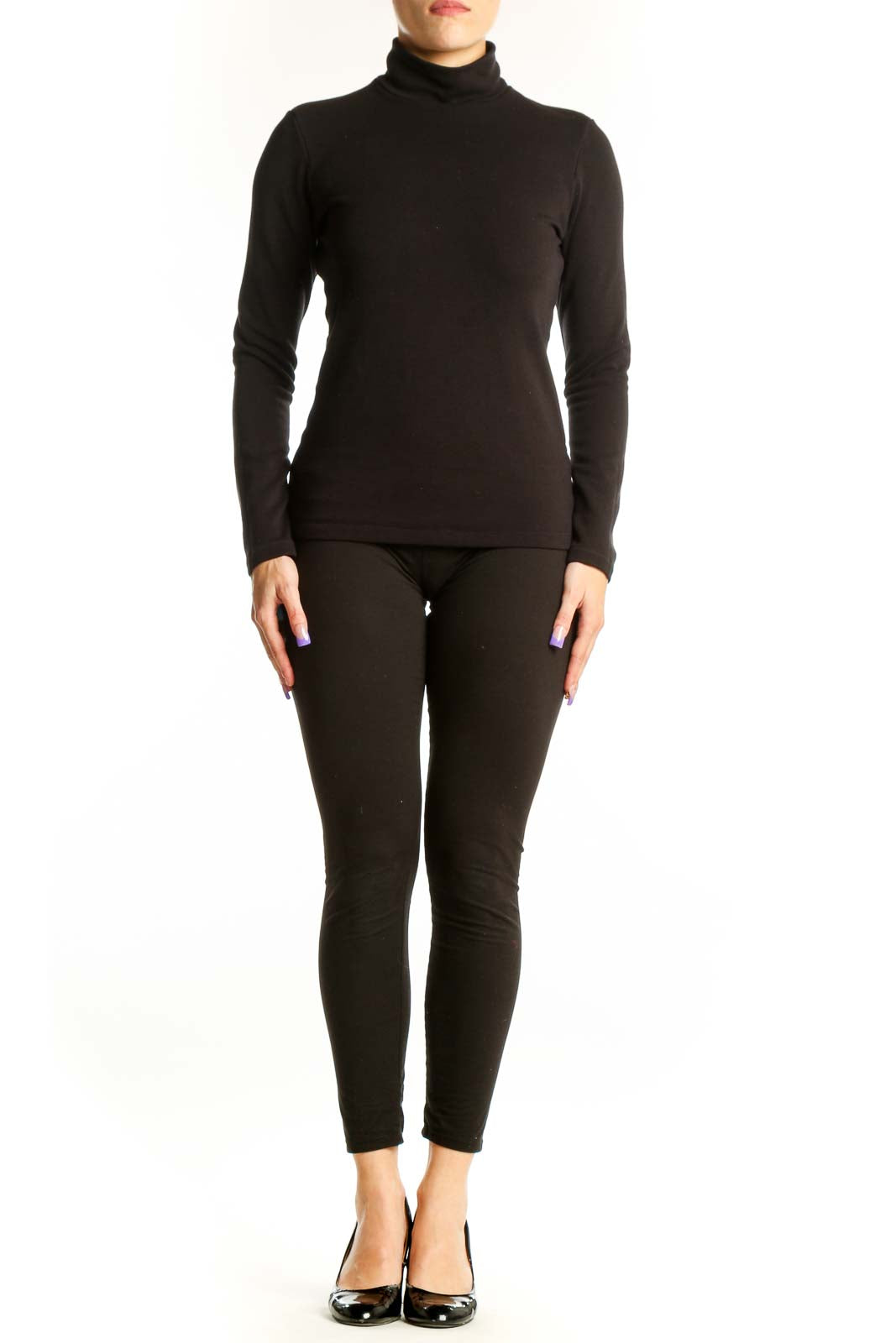Black turtleneck long sleeve fitted top by Uniqlo, front view on model