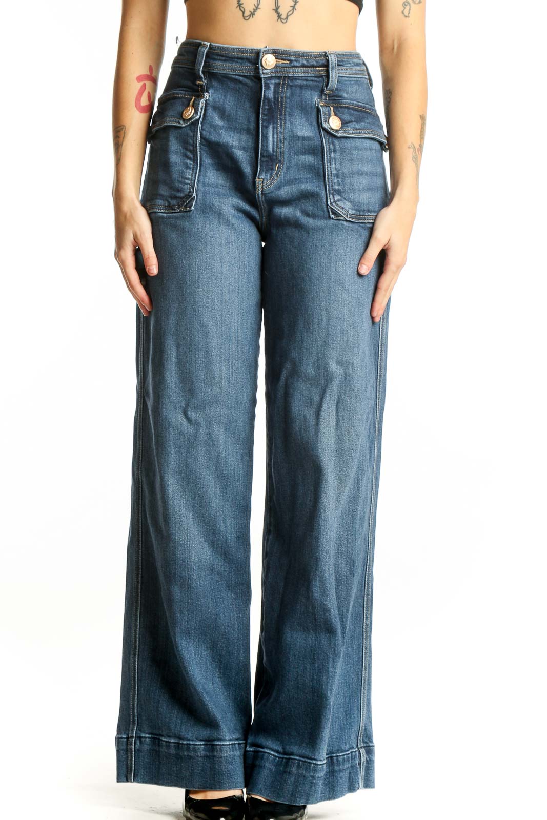 Front view of blue wide-leg cargo jeans with functional side pockets and high-rise waist