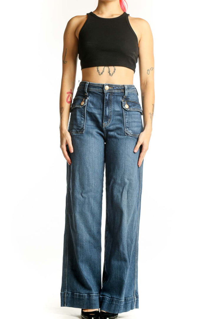 Front view of blue wide-leg cargo jeans with functional side pockets and high-rise waist