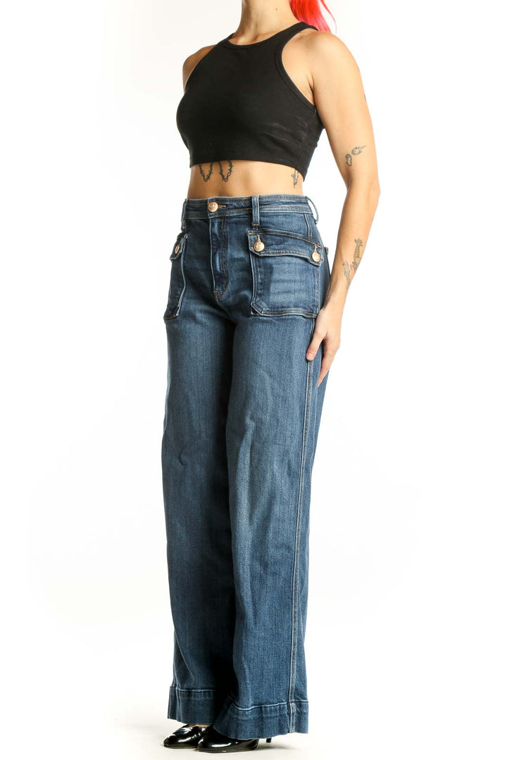 Front view of blue wide-leg cargo jeans with functional side pockets and high-rise waist