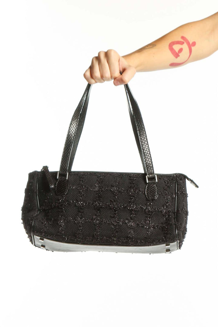Kate Spade black sequin shoulder bag with dual textured straps held in hand, front view