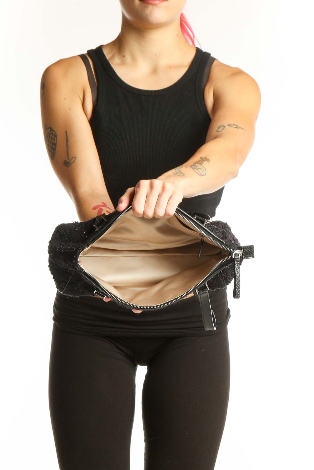 Kate Spade black sequin shoulder bag worn on shoulder, back view showing textured strap details