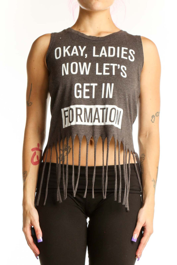Charcoal graphic cotton tank top with 'Okay Ladies Now Let's Get In Formation' text and black fringe hem detail, front view