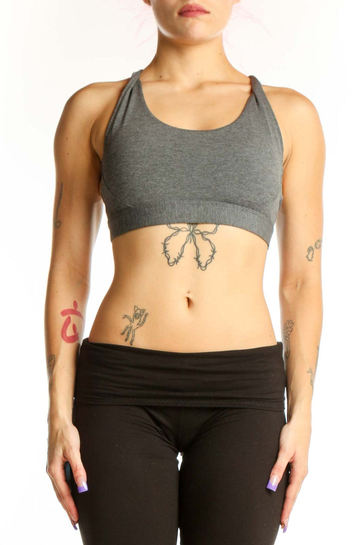Front view of gray Athleta racerback sports bra with black waistband, size S