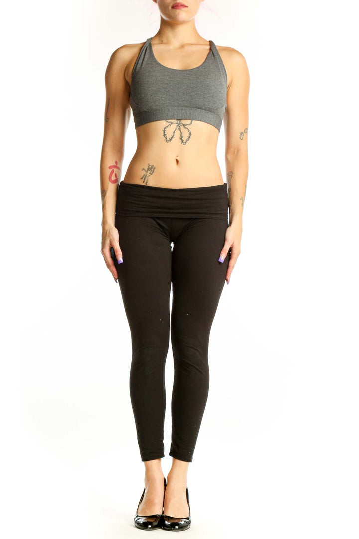 Front view of gray Athleta racerback sports bra with black waistband, size S