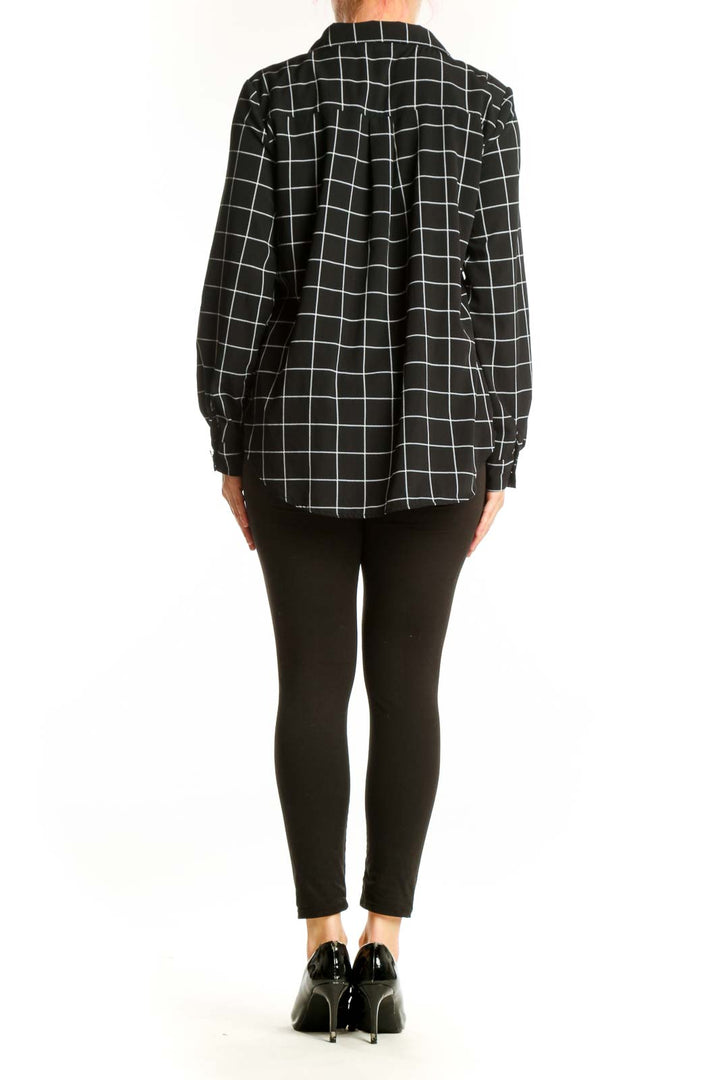 Black and white grid plaid button-up shirt back view showing full plaid pattern and relaxed fit