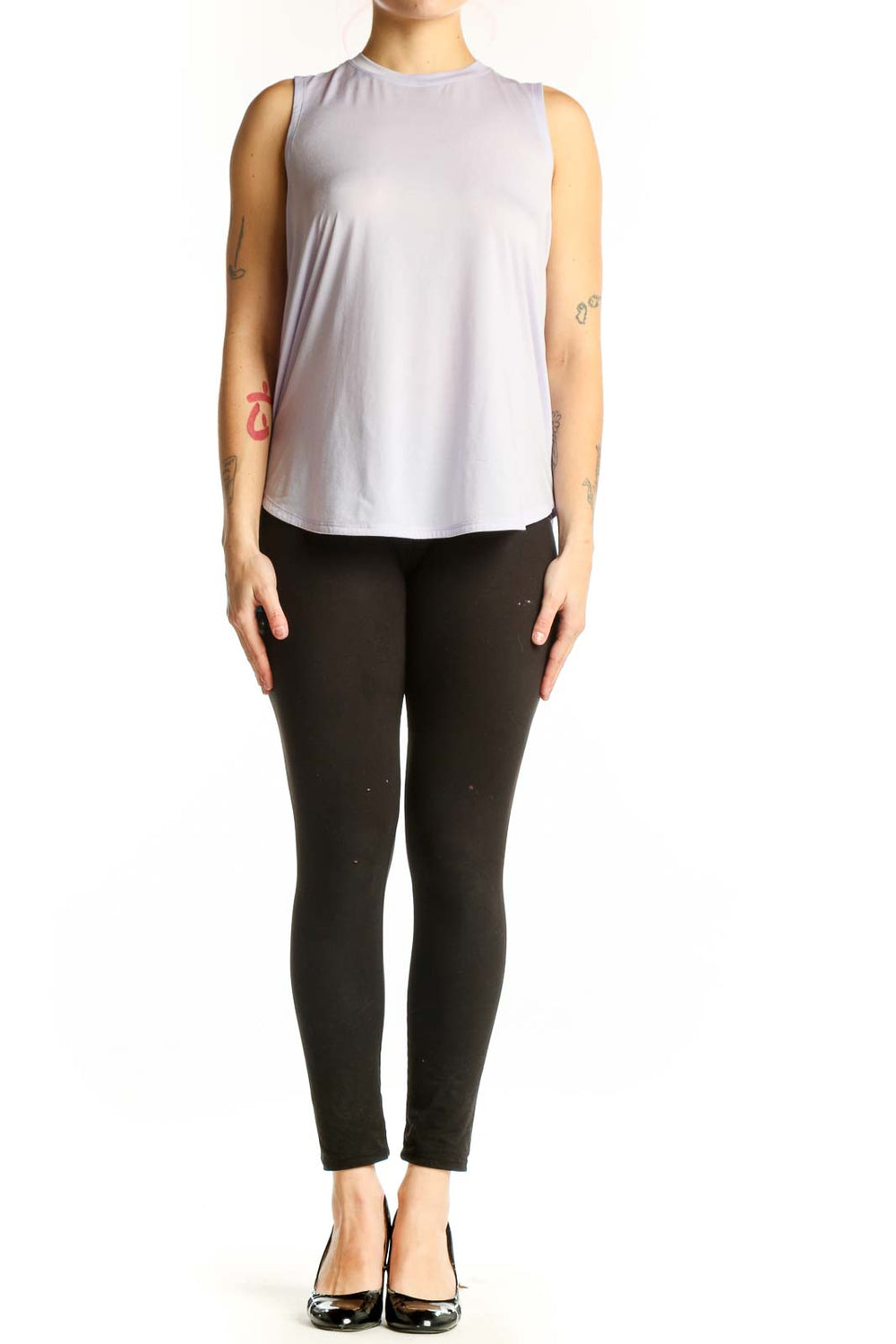 Lavender sleeveless Lululemon tank top worn with black leggings, front view