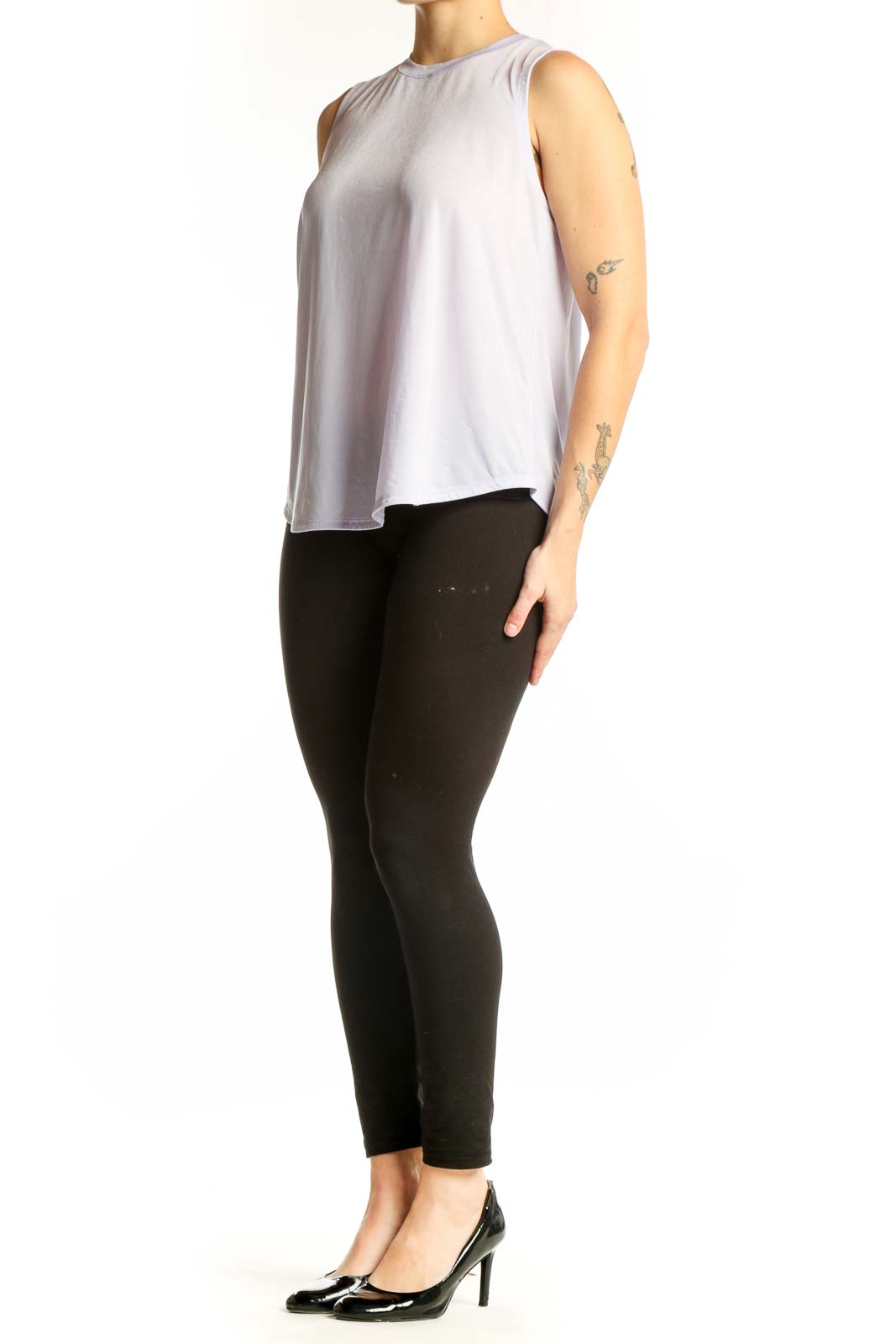 Lavender sleeveless Lululemon tank top worn with black leggings, front view